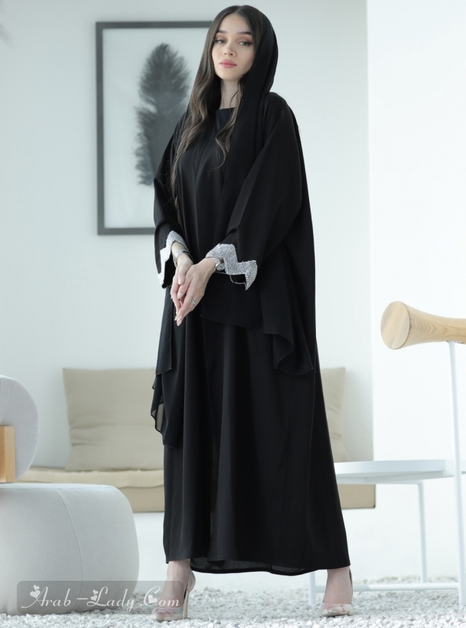 Black bisht Abaya with embellished sleeves. Comes with a headscarf.