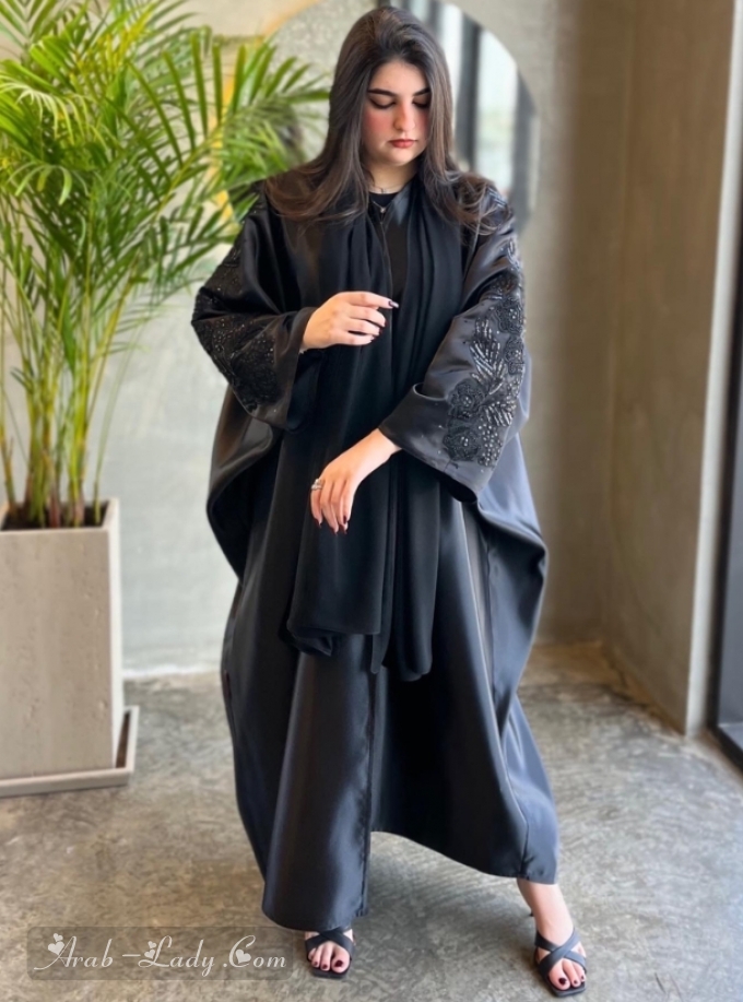 Black Taffeta Bisht abaya with embellished sleeves. Comes with a plain headscarf.