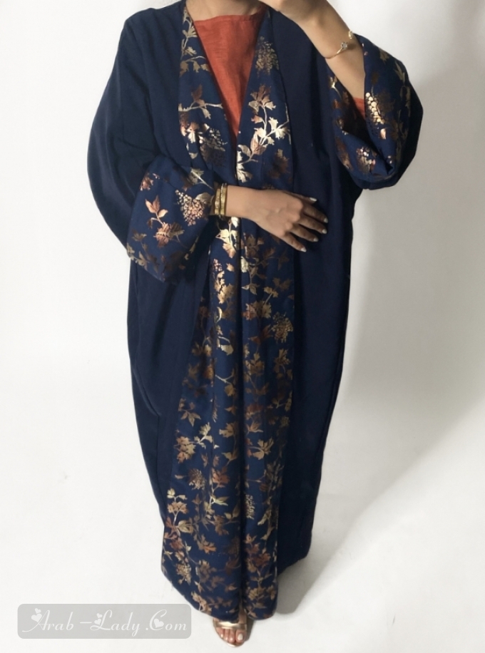 Navy Blue reversible abaya with metallic foil pattern trimmings. Comes with a headscarf.