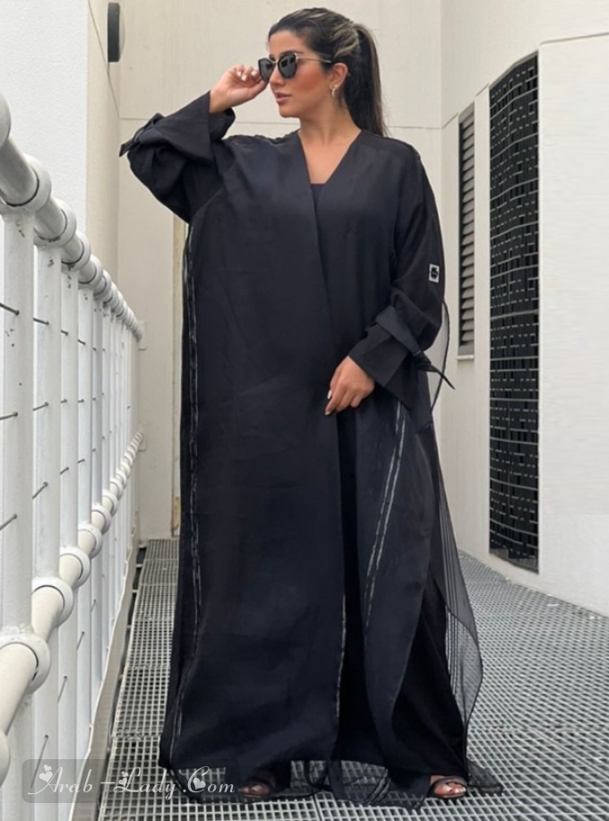 Black abaya with silk tulle overlay.